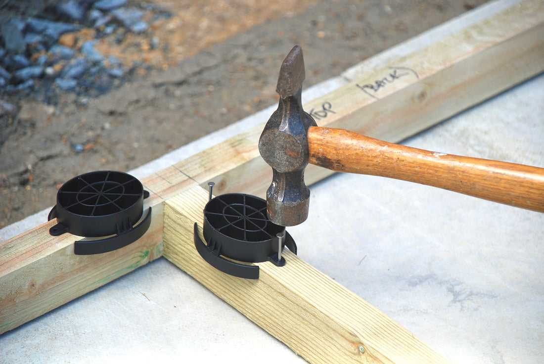 How does the SHED BOOT fix to the base of your shed?